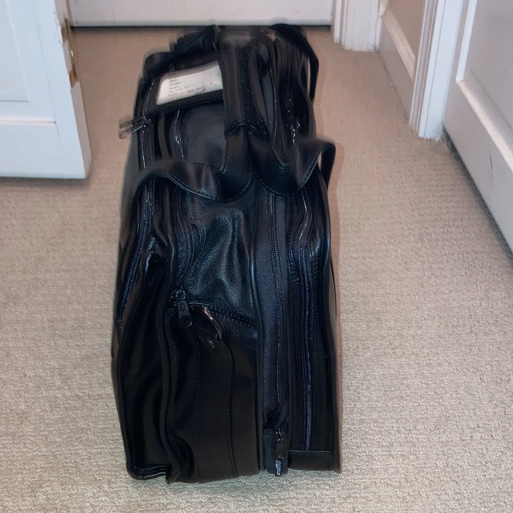 NWT black leather expandable multiple pockets with shoulder strap